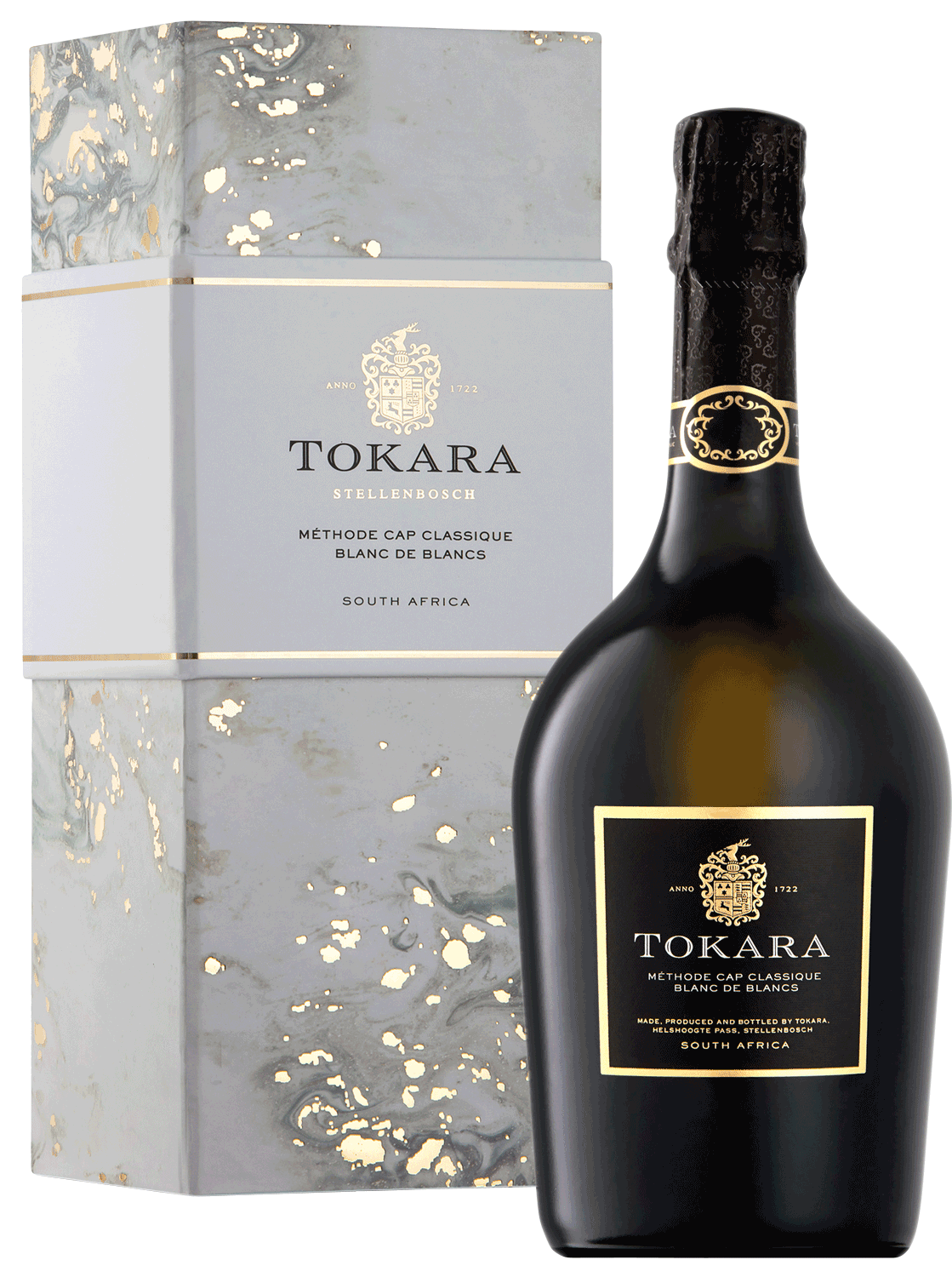 Eine Flasche Tokara Méthode Cap Classique Blanc de Blancs Schaumwein aus Südafrika steht neben der eleganten grau-gold marmorierten Geschenkbox.