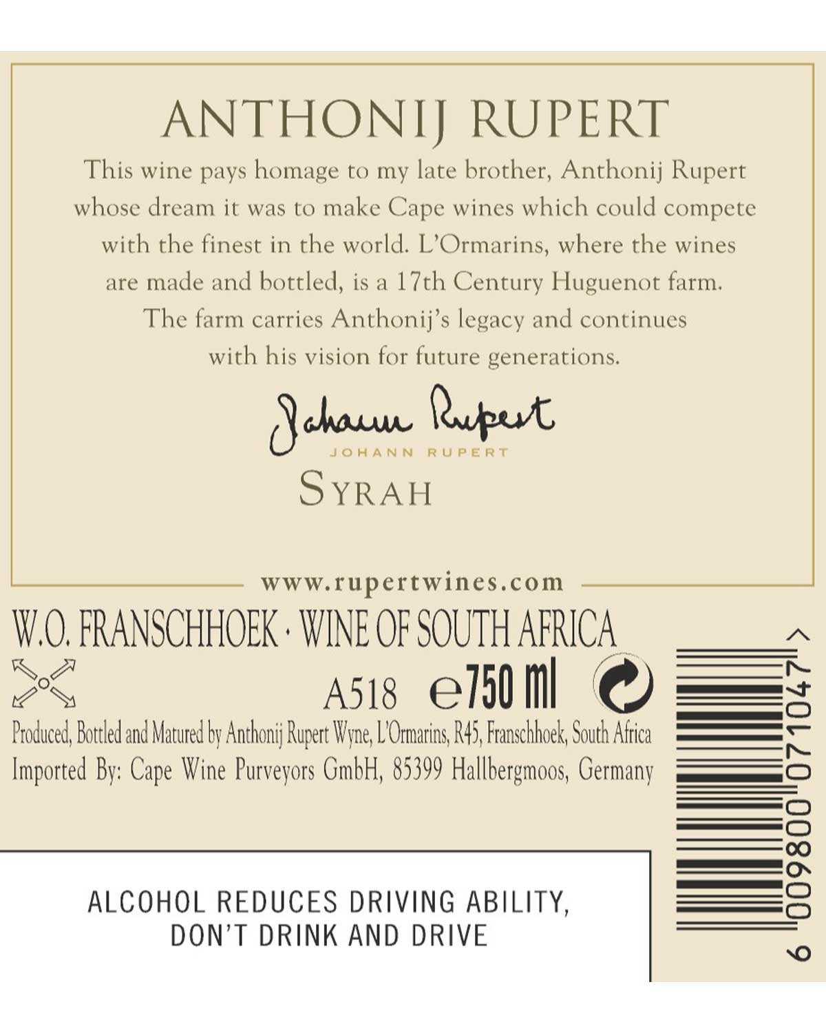 Weinflaschenetikett für Anthonij Rupert Syrah. Enthält eine Widmung, die Unterschrift, den Ursprung in Franschhoek, Südafrika, das Volumen (750 ml) und eine Alkoholwarnung. Cremefarbener Hintergrund mit schwarzem und goldenem Text.