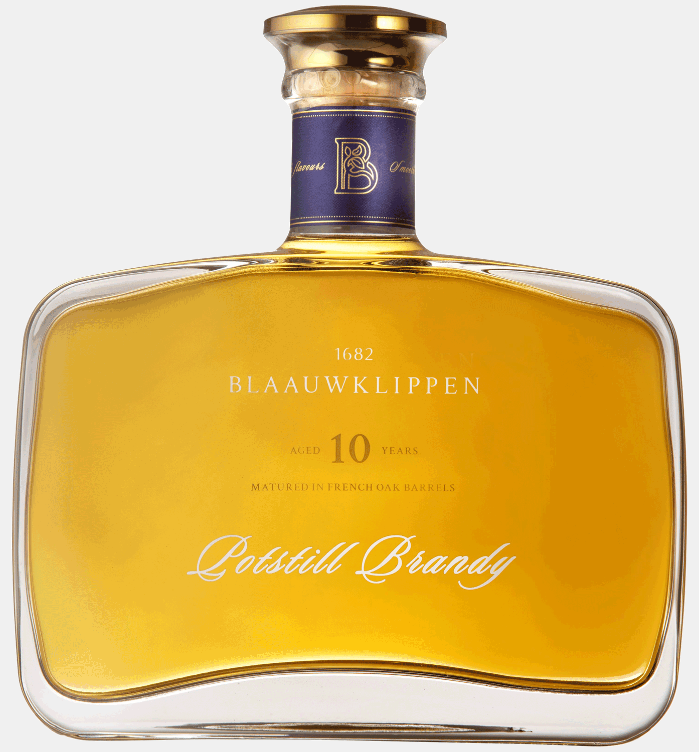 Eine rechteckige Flasche Blaauwklippen 10 Year Old Potstill Brandy befindet sich in einer blauen Schachtel mit einem durchsichtigen Kunststofffenster, das den Blick auf die goldbraune Flüssigkeit und das Etikett im Inneren freigibt.