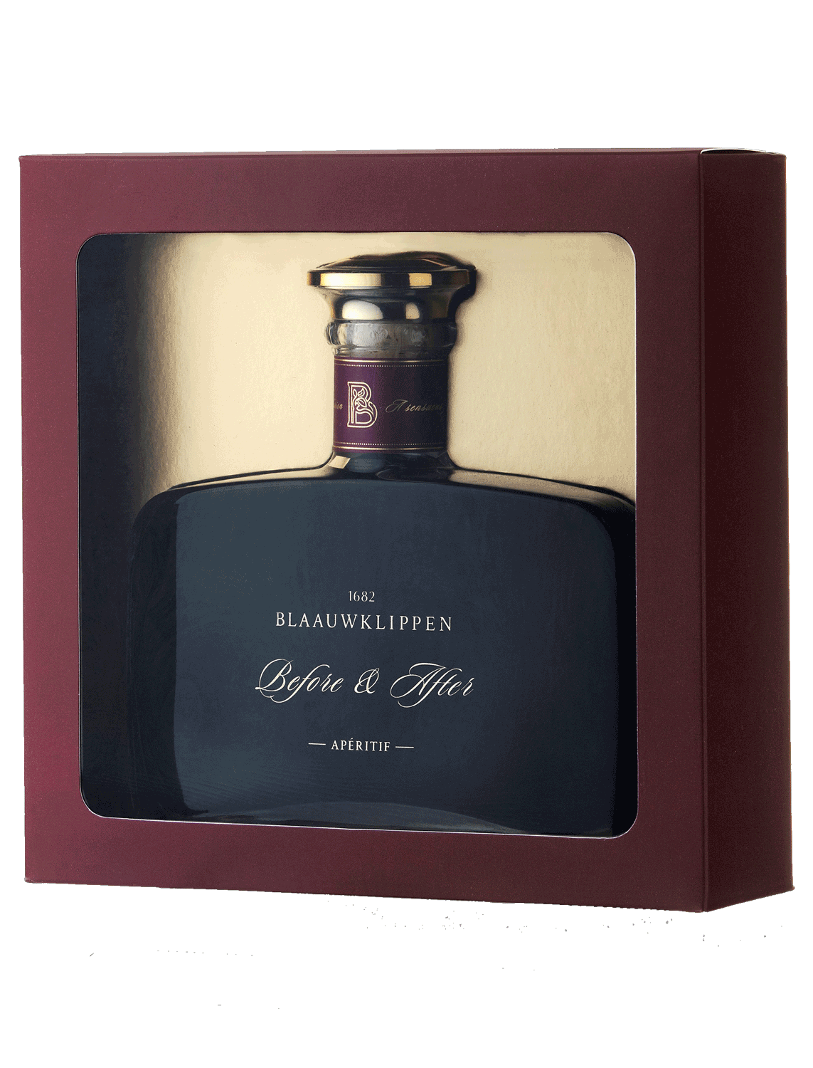 Eine verpackte Flasche Blaauwklippen Before & After Aperitif mit einer dunklen Glasflasche in einer kastanienbraunen Verpackung mit einem klaren Fenster.